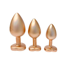 Carregar imagem no visualizador da galeria, Conjunto 3 plugs anais em metal dourados com brilhantes em coração - Pearl gold plug set