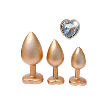 Carregar imagem no visualizador da galeria, Conjunto 3 plugs anais em metal dourados com brilhantes em coração - Pearl gold plug set